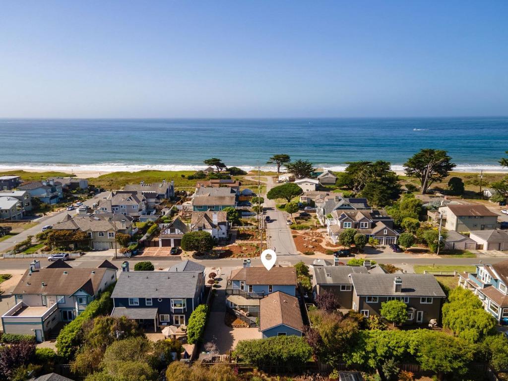 Location, Location, Location! Welcome to 71 Alameda Ave, a one-of-a-kind Coastal Gem on the west side of Miramar in beautiful Half Moon Bay. Just steps from the beach and scenic Coastal Trail, this stunning home offers the ultimate blend of luxury, comfort, and California Coastal Living. Featuring 3 Beds, 3 Full Bathrooms, 2,180 Sqft of living space, on a 6,600 Sqft Lot, built in 1993, updated throughout with modern elegance and Ocean views from multiple rooms and balconies. Step inside to discover a thoughtfully updated interior with, gleaming hardwood floors, recessed lighting, 3 beautifully remodeled bathrooms, a gourmet kitchen with quartz countertops and stainless steel appliances. The primary suite is a true retreat, boasting, a spa-like bathroom with a freestanding tub, ocean views, walk-in closet, fireplace, office enclave, and private balcony overlooking the Pacific. Downstairs features the living room with high ceilings and fireplace, next to the separate dining area, an office/den and 2 bedrooms/ 2 full bathrooms. The long gated driveway with ample parking leads to the finished 2 car garage. Low-maintenance landscaping with turf backyard, flagstone walkways, and paver driveway. Enjoy world-class surfing, kayaking, biking, hiking, and golf, just minutes from your door.
