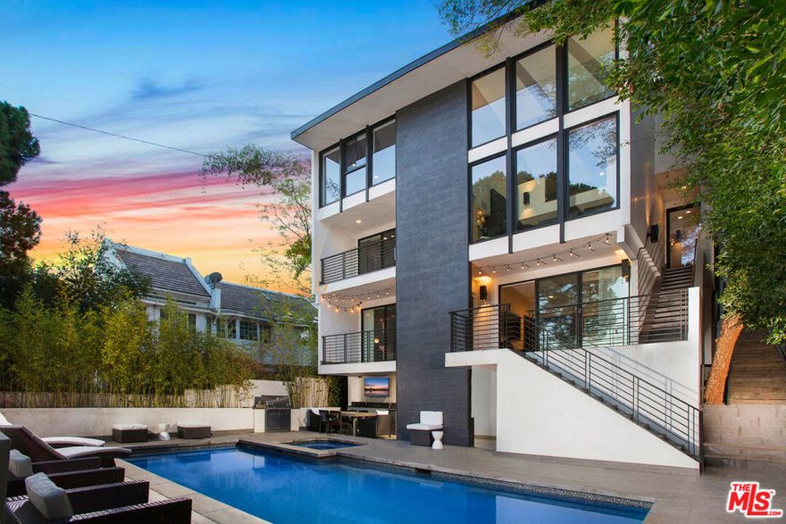 This home and all our listings are available immediately to assist displaced victims from the fires. Available fully furnished and turnkey for short, midterm, or long term lease! Experience luxury living in this fully furnished, ultra-modern estate spanning 4,600 sq. ft. of high-end design. This stunning home offers 5 spacious ensuite bedrooms and 5 bathrooms, all within an open-concept layout featuring sleek hardwood floors. The upscale chef's kitchen is a culinary dream, boasting an oversized island, Viking appliances, and a large wine cellar. Relax by one of the three wood-burning fireplaces or unwind in the master suite with a double steam shower, soaking tub, and spa-inspired amenities. Expansive windows provide breathtaking valley views, while the saltwater pool, spa, and private sports court create an outdoor paradise. The property is equipped with a smart home system for convenient control via phone or tablet, built-in speakers in every room, and a two-car garage. Nestled in a gated pedestrian-friendly area, this home offers endless upgrades and a lifestyle of comfort and sophistication. Contact us to schedule a viewing and make this exceptional estate your new home.