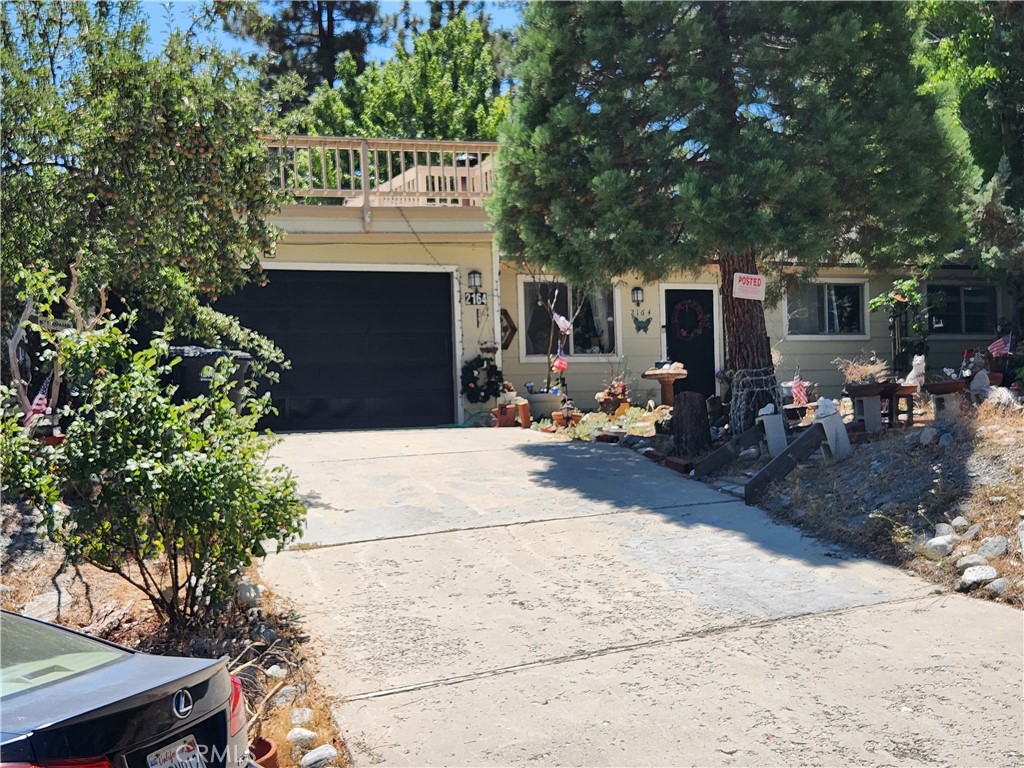 Welcome to this beautiful mountain home in the popular resort town of Wrightwood boasting breath taking views, fresh air and small town charm. This unique property offers the perfect blend of warmth, natural beauty and mountain living. This home features 3 Bedroom, 2 Bath with large family room, lots of upgrades with a lookout deck and Two car Garage. Inside is gambrel roof, great kitchen, laundry and ceiling fans. This home spans 1,480 square feet living area and sits on a generous 8,580 square feet lot providing ample view of the mountains. Step up to the lookout deck with a great sitting area to relax. Enjoy all four season of outdoor fun from skiing, snowboarding and hiking that Wrightwood community has to offer. Come experience the peace, privacy and enjoy the charm of Wrightwood living.