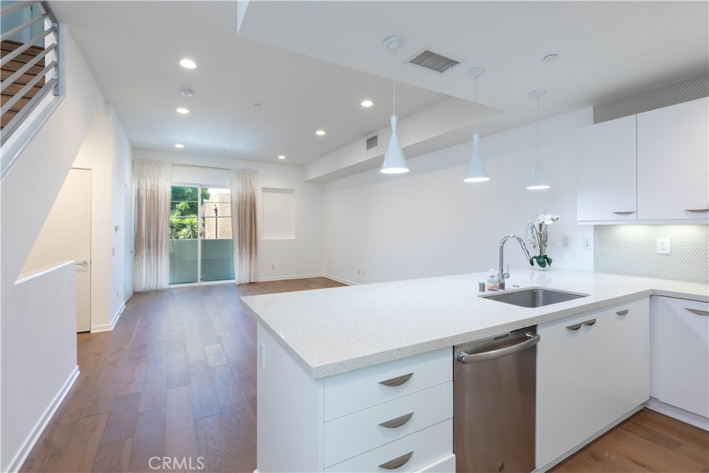 Live your best life at Blu, a 2019 newly built Modern community, offering tri-level homes in North Hollywood. Unit 4831 is an exceptionally well-kept home featuring: freshly painted interiors, 3 spacious bedrooms, 4 bathrooms, 1562 sq ft of naturally lit interior space with a beautiful rooftop deck with panoramic city views. Location, Location, Location, this contemporary home is centrally located in Los Angeles County mins from: Noho Arts District, 4 mins to Toluca Lake, 8 mins from DT NOHO, 9 mins to Studio City (Universal Studios Hollywood), 11 mins to Burbank Airport and 30 mins to DTLA or WEHO. Noho is known for their growing food scene, nearby craft cocktails and beer spots, trendy bars, shopping, coffee shops, access to organic and vegan grocery stores, fitness studios & gyms and an exciting nightlife. Built in 2019, this sophisticated home doesn’t fall short with clean lines, on-trend style and functionality. With an attached 2-car garage with EV charging, this home is made for a person who is always on the go. Don’t have time to park in the garage? An extra parking spot in front of the garage comes in handy especially with the hustle and bustle of LA. Overworked? I’ve got the remedy! Enjoy a glass of your favorite drink while taking in some relaxing LA views on the rooftop deck, do a sunset yoga session or meditate. This rooftop is perfect for a BBQ, light reading, getting a little sun or enjoying quality time under the LA stars; right in front of a flickering stone fireplace. Feeling a little chilly after sunset? Well, come on in where you enjoy the warmth of a newly installed HVAC system (2024). This home is so versatile; as it is great for single young professionals who like their space, newly married couples or a family with a couple of children! The modern kitchen is equipped with a newer oven/stovetop, Stainless Steel appliances including a: GE 3-door fridge with Keurig (coffee maker) attachment, GE 5-burner stove, GE dishwasher, GE front loading Washer & Dryer. Four bathrooms some have with touch-activated mirrors and double sinks. Consider this luxurious home as your blank canvas ready to take shape as you showcase your creative style and highlight personal touch. Other amenities include: gated entry, convenient in-unit laundry, storage space on the rooftop and in the garage. All things that offer more safety, convenience and cleanliness. This home looks even better in person! You’ve got to see for yourself! Book your showings today!