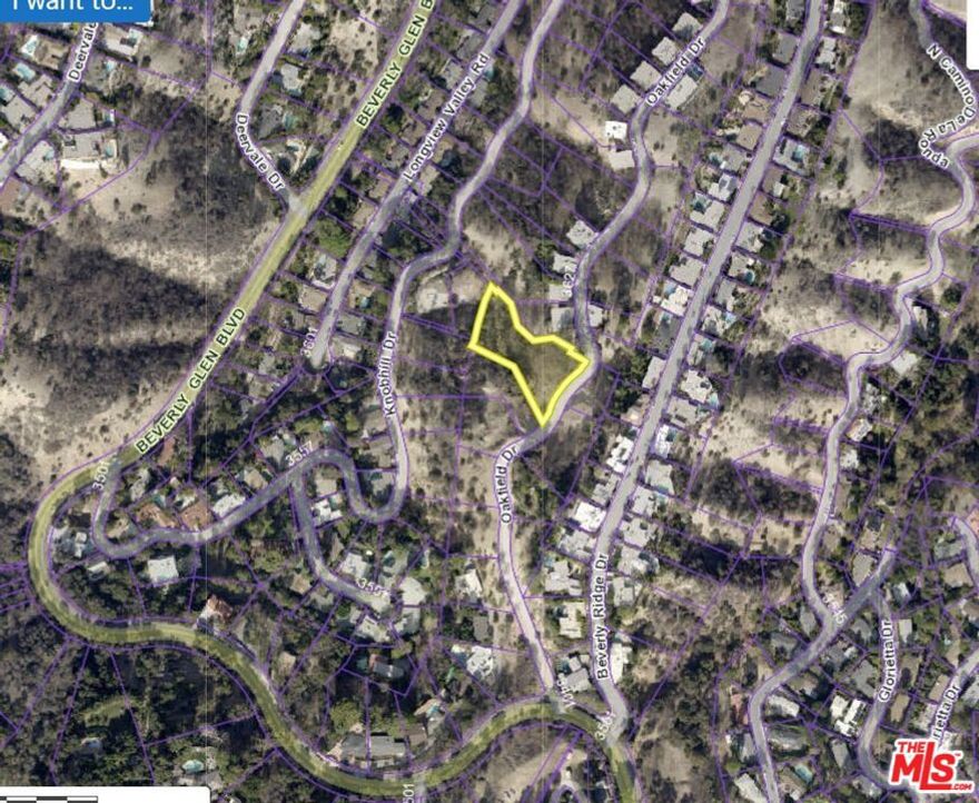 Over 3/4 of an acre, this prime downslope lot  on one of the most iconic streets in the story of Los Angeles mid-century architecture offers the opportunity to build the home of your dreams and to join architectural history along Oakfield Dr. which is home to 17 Richard Neutra designed homes. This lot is located next to the last one of those homes, with views out over Beverly Glen Canyon, exploding out to the shimmering lights of the San Fernando Valley and the majesty of the San Gabriel Mountains in the distance. It offers an exceptional setting in a historic and prestigious location for bringing to life the home of your dreams. The lot immediately west, with a Knobhill Address, and contiguous lots immediately south on Oakfield are also available for sale and could be purchased either separately or in combination with this one, offering  even more investment potential and design possibilities. Call agent for details.