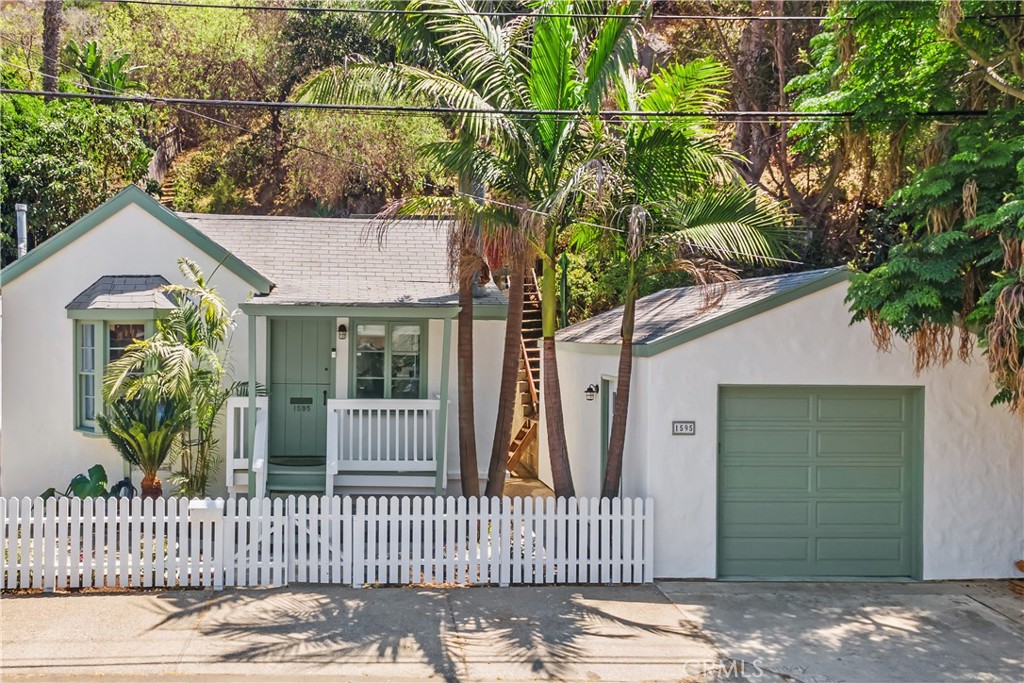 Fall in love with this charming bungalow-style cottage in the highly sought-after canyon area of Laguna Beach.
Situated on a generous 7,500 sq ft lot, this is the best-priced single-family home in Laguna Beach—with potential to expand or add an ADU.
Tucked away at the end of a quiet, flat cul-de-sac and backing to a tranquil nature reserve, the home offers peaceful views and direct access to hiking trails.
Inside, the 842 sq ft floor plan features 2 bedrooms and 1 bath. The kitchen has been tastefully updated with newer cabinets, quartz countertops, and stainless steel appliances. A spacious one-car garage, with additional parking in front of the house, and ample street parking provide convenience for you and your guests. The private backyard is perfect for creating an artist’s retreat, building an ADU, gardening, or simply relaxing in your own coastal hideaway. Enjoy close proximity to Main Beach, Sawdust Art Festival, Pageant of the Masters, renowned galleries, cultural attractions, and endless outdoor adventures—everything this world-class coastal community has to offer. This is a rare opportunity to own a slice of Laguna Beach paradise.