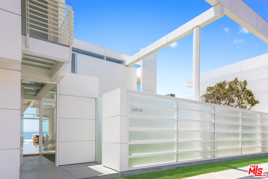An architectural masterpiece, located on the world's most coveted beach spanning 105 feet of oceanfront width (a triple sized lot). An iconic residential masterpiece featured in many publications, designed by Richard Meier, architect of such wonders as the Getty Center in Los Angeles and the Barcelona Museum of Contemporary Art. Built with the highest level of detail and craftsmanship for one of the most important art collector's in the world, the home features a light filled 2 story entry and living room with walls of glass overlooking the deepest sandiest beach in Malibu, beachfront decks for entertaining and a private grassy yard. There are 5 bedrooms, 7 baths, and a full guest house, beautifully proportioned with exacting details throughout. Completely private and gated. A true once in a lifetime opportunity. Shown to pre-qualified individuals only.