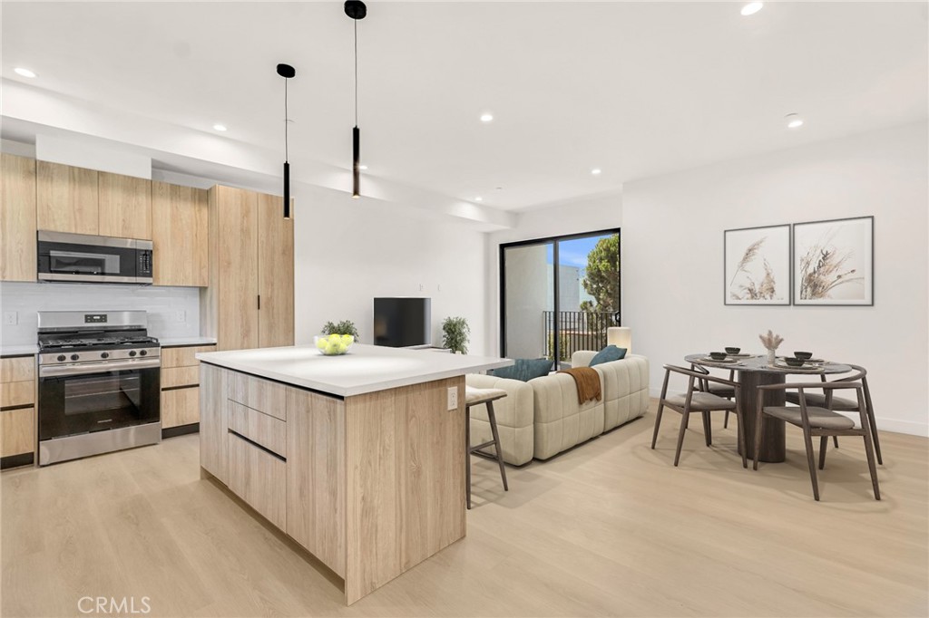 Be the first to live in this brand-new, ground-up construction—a true showstopper located near The Grove. This two-bedroom, two-bath unit boasts soaring high ceilings, modern finishes, and a spacious open floor plan flooded with natural light. Step into a designer chef’s kitchen featuring custom quartz countertops, a large island with bar seating, stylish backsplash, and brand-new stainless steel Frigidaire appliances—including a refrigerator, stove, dishwasher, and built-in microwave. Both primary suites are generously sized with walk-in closets and spa-inspired en-suite bathrooms adorned with custom tile work and elegant vanities. Relax on the private patio, perfect for unwinding or having your morning coffee. Additional features include: In-unit washer and dryer, Central A/C Two parking parking spaces, with elevator and stair access. This unit combines luxury living with unmatched convenience in one of LA’s most sought-after neighborhoods. Don’t miss this rare opportunity!