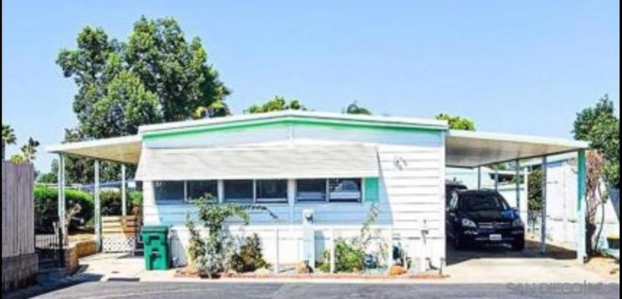 Welcome to Greenfield Mobile Home Estates, an all-ages community in El Cajon! This spacious 1973 manufactured home has been updated into a 3-bedroom, 2-bath open-concept layout with approx. 1,344 sq. ft. of living space. Enjoy a bright, flexible floor plan with no neighbor on one side and the benefit of being next to the community common area and dog park — ideal for extra space and pet owners. This is the lowest-priced home in the park, offering exceptional value. Community amenities include a clubhouse, pool, recreation areas, and laundry center. With low property taxes, pet-friendly rules (with restrictions), and a central location near schools, shopping, and freeway access, this home is a smart choice for families, first-time buyers, or anyone seeking affordable homeownership in San Diego County.