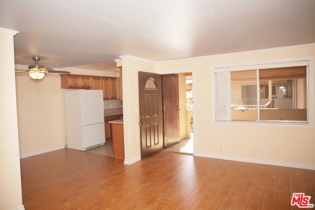 Meticulously upgraded 1 bed 1 bath has new laminate wood floor & paint, enhanced framing to all interior windows, sound proof ceilings lined with elegant crown molding & a sun filled outdoor patio with custom tile! The bright & airy master suite offers a huge wardrobe closet with custom built HIS & HER dresser drawers and a separate closet for linens & towels. The master bathroom is completely upgraded with a walk in shower, quartz bathroom vanity with brushed nickel fixtures & newer tile floors. The gourmet kitchen is a chef's delight with beautifully appointed cabinetry, crown molding, granite counters, tile back splash and newer gas appliances plus a drawer style dishwasher. Garage parking for 1 car & expanded personal storage to fit a bicycle, surfboard, etc. Building offers a fitness center, tennis & basketball courts, an outdoor swimming pool & Jacuzzi, BBQ grills, commercial laundry facilities & elevator access. HOA pays for gas, electric, water and trash.