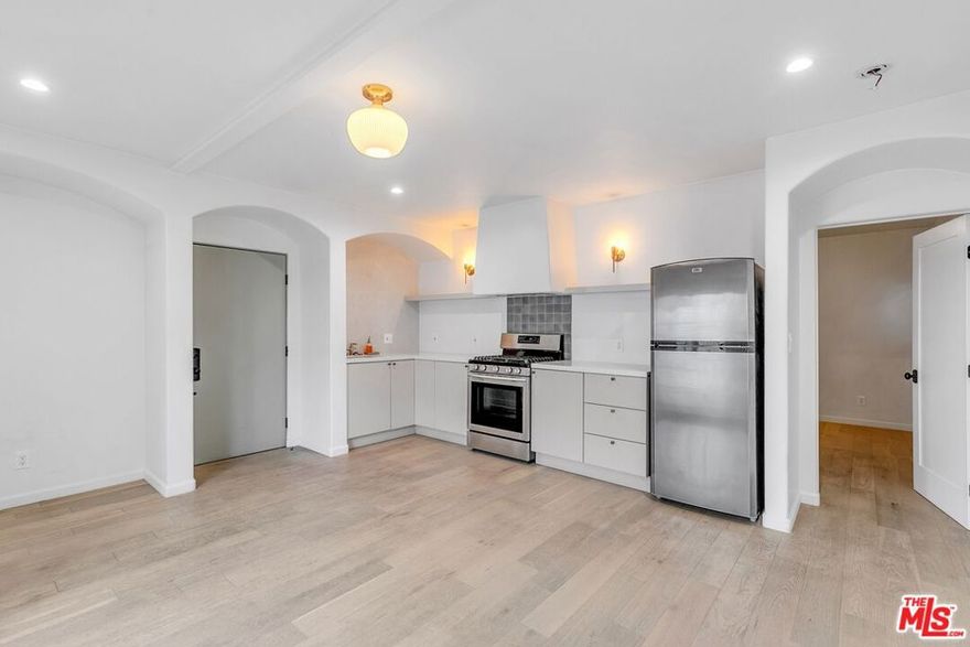 Welcome to Casa Larissa! Nestled in the hillside above Sunset Blvd in the heart of Silver Lake, Casa Larissa is an original 1920s Spanish 4-unit community re-envisioned with timeless beauty and unparalleled artistry by Studio Cadiz. This one-of-a-kind first-floor rental blends classic Eastside charm with sophisticated modern details, offering a unique opportunity to live in a thoughtfully designed and lovingly restored space. Come inside and be greeted by handcrafted details that make this home truly special: curved arches, French doors, and custom built-ins. The interior features stunning white oak flooring, a custom kitchen with quartz counters, brass fixtures, smooth stucco walls, and a Cle tile backsplash. French doors lead to a private, spacious Ipe wood deck patio with custom wrought iron railings, a perfect spot to unwind or entertain. The unit boasts locally sourced artisan light fixtures, a front deck in the living room with breathtaking views of the Silver Lake Hills, and a bathroom adorned with Arto tiles and smooth stucco shower walls. Additional conveniences include in-unit laundry, ductless AC and heat, and updated windows to ensure you are living your best life in 2025. Casa Larissa's community outdoor space offers a landscaped hillside patio featuring panoramic easterly views of the cityscape. All this, just one block from the shops, cafes, and restaurants of Sunset Blvd! Don't miss this rare opportunity to call Casa Larissa home. Schedule a viewing today!