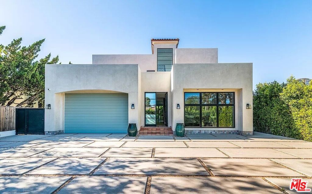 Rare newly constructed 5 bedroom, 5 bathroom Spanish contemporary with incredible indoor/outdoor flow! This property is on an oversized lot with mature landscaping and hedges, creating a peaceful oasis. The upper floor contains 4 spacious bedrooms each with their own en-suit bathroom and balcony. The oversized primary bedroom has a dressing room and spa en-suite bathroom with a rain shower, steam shower, and freestanding soaking tub. Downstairs, you'll cook and host in the beautifully designed kitchen with marble counters, Miele appliances, and a huge entertainer's island. The living and dining areas are bright and airy thanks to Lincoln bi-fold doors that open the entire lower level to the grassy backyard with saltwater pool and hot tub. The downstairs bedroom also opens to the yard and could be used as an office to work from home. This dreamy residence features several balconies and courtyards, making great use of the large lot. In addition, there is a rooftop terrace with sunset and mountain views. Plenty of room for vehicles with a 2-car garage plus private gated motor court.