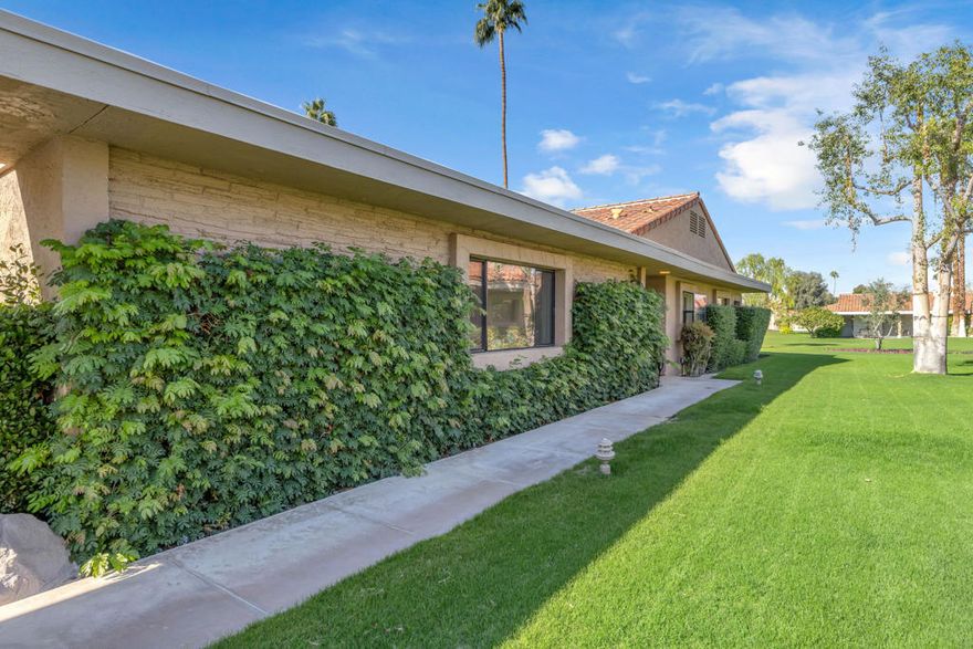 Step into desert elegance and discover a beautiful refreshed Indian Wells retreat set within a WORLD-CLASS country club offering 36 holes of championship golf. This condo has been freshly painted throughout, including the garage- designed for comfort, style and effortless living. Inside soaring ceilings, refined soffit details and recessed lighting highlight a stunning great room that flows seamlessly into the kitchen and breakfast bar, perfect for entertaining or relaxed gatherings.  This residence offers two private bedroom suites, including a standout OVERSIZED PRIMARY RETREAT spacious enough for a sitting or lounge area. Great walk-in closets with bathrooms brighten up by skylights. Enjoy true indoor-outdoor living with a private courtyard featuring a hot tub and a back patio framed by a short privacy wall overlooking the flush greenbelt and mountain peekaboos.Situated within a community celebrated for its breathtaking surroundings, this home provides both privacy and tranquility just steps from the community pool. Residents enjoy world class amenities, including championship golf, tennis garden perks, fitness center, fine dining and other exclusive Indian Wells homeowner benefits.