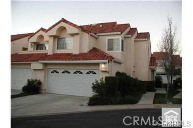 Light bright and roomy townhouse near end of cul-de-sac. Formal dining area off living room, which features a gas fireplace. French doors open from living room to patio. Open kitchen area to family room with custom wood sliding doors that open to covered patio. Master bedroom has high ceilings and two closets with closet organizers and mirrored sliding doors. Double vanity in master bath with full bath and shower. Third room is open and can be used as office or bedroom with built-in oak book case and desk. Low maintenance, completely enclosed private backyard with flag stone patio and planters. Great for entertaining! Direct access two car garage with additional room to park on driveway. Located in prestigious Niguel Point community with association pool, spa and private tennis courts. Very close to parks, shops, restaurants and movie theaters.