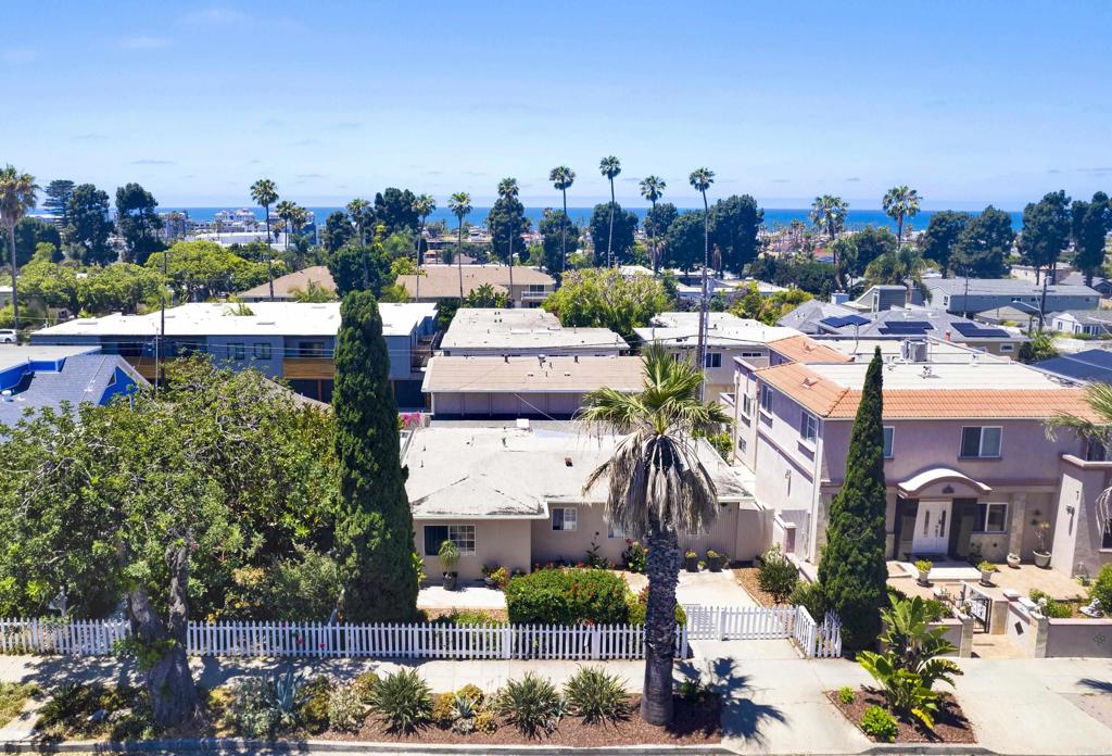An exceptional investment opportunity in the heart of coastal Oceanside. Just minutes from the beach and downtown, 509 North Horne Street offers a versatile three-unit layout with outstanding potential for renovation, expansion, or redevelopment. The property includes over six bedrooms, four bathrooms, and two half baths thoughtfully arranged across a flexible floor plan. The main residence features four bedrooms and two and a half baths, while two fully detached accessory units are positioned at the rear—each paired with its own two-car garage. The generous lot and existing improvements provide a strong foundation for modernization or a complete reimagining into contemporary multi-unit living. Set within one of North County’s most dynamic coastal markets, this property blends scale, flexibility, and location—presenting a rare opportunity for investors and developers to shape the next chapter of Oceanside’s evolution.