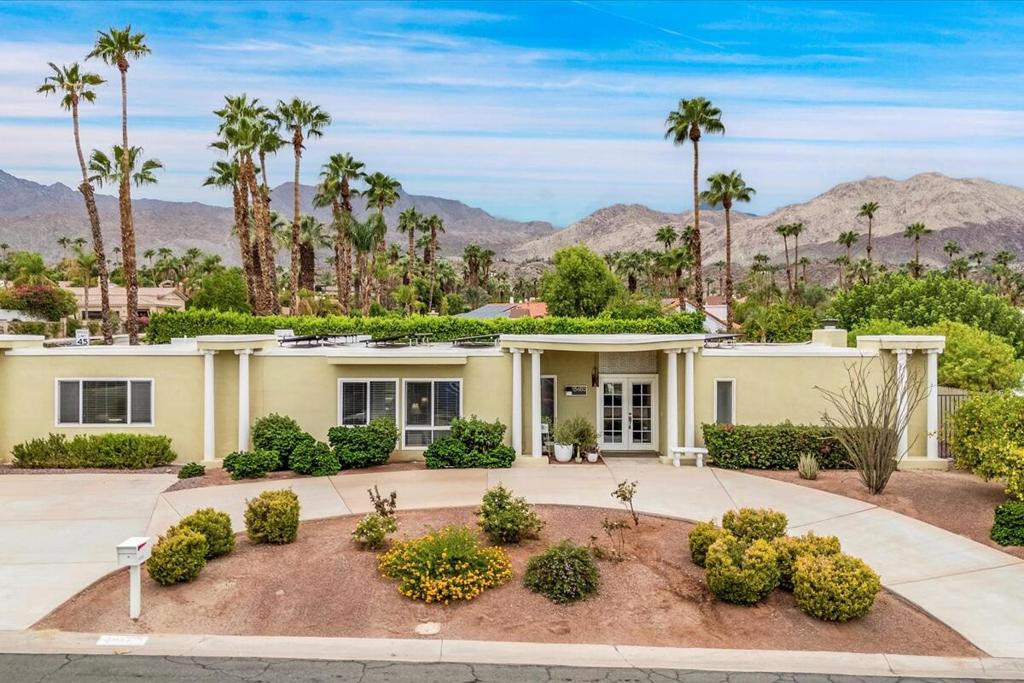 Escape to authentic mid-century style in this rare 1964 Bob White-designed treasure, nestled on a spacious corner lot in the coveted Highland Palms Estates of South Palm Desert. Framed by unobstructed mountain vistas and thoughtfully sited away from unsightly power lines, this architecturally significant residence is a true Palm Desert gem for lovers of classic modern design. Inside, a luminous wall of glass captures the iconic desert landscape, seamlessly connecting soaring open-plan living and dining spaces to the outdoors. This home is a perfect backdrop for curated vintage furnishings and stylish entertaining. Original features like the elegant fireplace and rear cabana speak to the era's legendary indoor-outdoor lifestyle, while the sweeping backyard is anchored by a generous private pool making this an entertainer's paradise for afternoon lounging or sunset martinis. With four bedrooms and three baths, including a flexible attached casita with its own private entrance, kitchen, living room, bedroom and bath. The layout offers ultimate versatility. Live in the main quarters and host guests, or generate extra income with seasonal rentals, a valuable opportunity in Palm Desert. A paid solar panel system ensures energy efficiency, cost savings, and modern comfort, blending sustainable living with mid-century authenticity. Ample parking is available with a classic circle drive. Discover your architectural oasis, designed to delight those who cherish clean lines, sunlit spaces, and the enduring glamour of the mid-century desert lifestyle. Paid SOLAR!