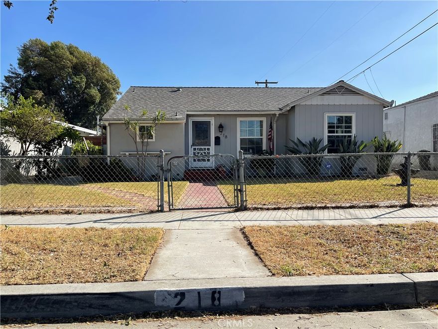 Welcome to 218 W Gardner St in the City of Long Beach. This beautiful home features 3 bedrooms 2 baths, 2 car garage with carport for extra parking. Also featuring Central Heat and Air, Inside Laundry Area, Fireplace, Big Living Room with plenty of Natural Light from the oversized Glass Sliding Door  leads you to a relaxing Back Patio. Main suite features a spacious size Bedroom, Big Closet, Spa like- tile Walk in Shower with enough room to be comfortable. This amazing home also has a good size front and back yard with grass and plenty of room to Barbecue while enjoying with your friends and family enjoying the amazing weather a city by the beach. Clean Alley Access, Newer Composition Roof (6yrs) are just a few more details this home has to offer. Located just minutes away from Shopping Malls, Long Beach Pear, Cal State Long Beach/Compton Community College makes this home truly a must see on your list. Don't miss out come see this home today before its gone!