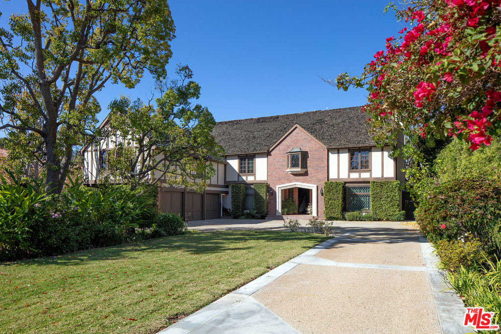 Warm, inviting 2 sty English set behind gates on 18K sq ft of level land in prime BW Park. Situated between San Vicente & Sunset & surrounded by magnificent estates, this timeless home on desirable west side of South Cliffwood offers grt privacy, yet is close to all the amenities that BW has to offer. Deep setback w/ circular dr & lush gardens leads to this stately home w/ perfect flr plan, hi ceilings & well-proportioned spaces. Gracious, dble-height entry opens to rich, paneled lib w/ FP, FDR, LR w/ FP, remod cook's kitch & sun-filled fam rm w/ soaring ceilings & French drs that open to trellis-covered patios, grassy yd, pl/spa. 5 en-suite BDs, incl a fab master suite w/ lg pvt terrace, FP & dual BAs & walk-in closets, + a very lg up fam rm/play rm. Hrdwd flrs, crown mouldings, coffered ceilings & leaded glass windows are just some of the many rich finishes and detailing that can be found throughout the home. A truly rare opportunity in the very finest Westside location.