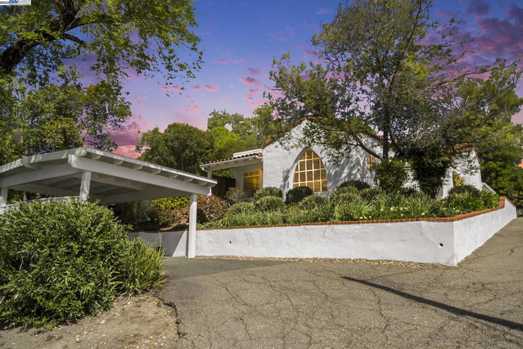 Incredible opportunity to own a rare duplex on the highly desirable Westside of Danville. Just a short walk to downtown shops, restaurants, and the Iron Horse Trail, this charming property sits on a generous 12,632 sq ft lot and features two separate units, each approximately 1,200 sq ft. The front unit offers 2 bedrooms and 1 bathroom and is filled with character and natural light and too many updates to list. Highlights include a striking arched window, hardwood floors throughout, arched doorways, and fresh interior paint, new roof, newer furnace and water heater. Lovely updated kitchen features white cabinets, beautiful countertops and plenty of cabinet space. A spacious, private backyard includes a large deck, mature landscaping, and established garden beds. This unit has a strong rental history and typically leases for $4,000 per month. HUGE driveway with potential to house RV and/or boat plus 2 carports. Rear unit includes 2 bedrooms and 1.5 bathrooms with a cozy family room, brick fireplace, and skylights. The galley kitchen provides efficient layout and functionality, and the unit also includes ceiling fans and laundry facilities. Currently rented to a reliable month to month tenant at $3,000 p/mo. Plenty of room for a detached ADU with no owner-occupancy requirement.