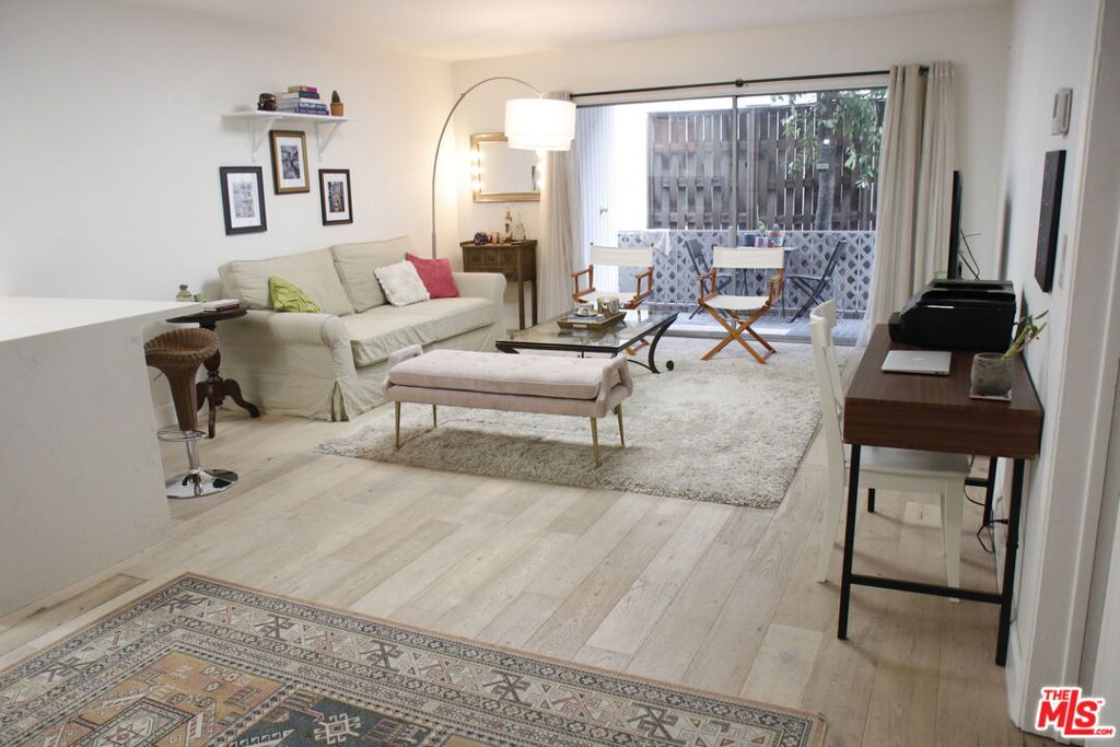 Welcome to Unit 112 at Toluca Villas! This inviting space features a spacious open floor plan, a large bedroom with a walk-in closet, and a full bath with a separate tub and shower. Enjoy cooking in the modern kitchen with stainless steel appliances and sleek white and gray quartz counters. Relax on your private patio with sliding glass doors, perfect for morning coffee or evening unwinding. Nestled in a quiet, pet-friendly complex with a sparkling association pool, this unit offers peace and privacy while being just moments from Warner Brothers Studios, trendy shops, and restaurants. Experience the best of Mid-Century charm and modern living.