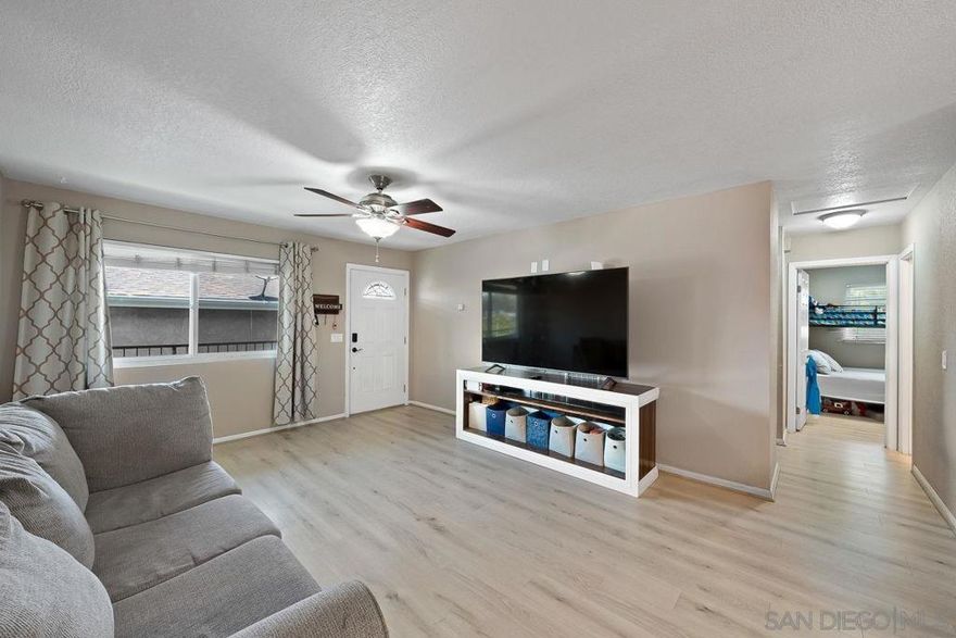 Beautiful 2 bedroom, 2 Bathroom second floor condo featuring beautiful new luxury vinyl flooring, dual pane windows throughout, granite countertops, stainless steel appliances, and mirrored closet doors. 2 assigned parkings for the unit. This condo is FHA and VA approved and the low HOA covers your trash and water. Conveniently located close to freeway and shopping.