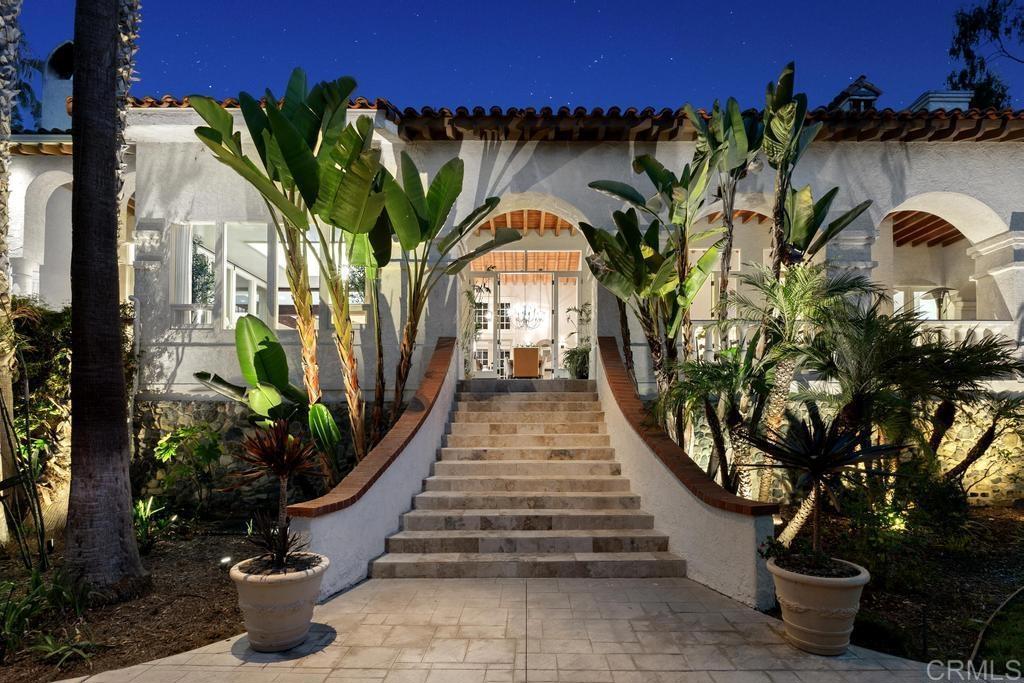 Tucked away on a private hilltop, this 5-bedroom retreat offers breathtaking mountain and valley VIEWS along a lush, tree-lined drive. Situated in the only gated community within the prestigious Rancho Santa Fe Covenant and the highly sought-after Roger Rowe school district, this rare gem is also part of the gated South Pointe Farms community. The home boasts soaring ceilings, large picture windows, and French doors, filling the space with natural light and a refreshing ambiance. The main-floor primary suite features a modern bathroom with a steam shower, soaking tub, wood-burning fireplace, two walk-in closets, and a cozy lounge or office nook overlooking the beautiful grounds. Upstairs, you'll find three additional bedrooms, two full baths, and a media room with an adjoining hobby or wrapping room. The gourmet kitchen opens to a bright breakfast area and a family room that leads to a tranquil outdoor patio and an underground wine cellar just a few steps away. Spanning 2.99 manicured acres, the property includes expansive lawns, a lap pool, space for a pickleball or sports court, and a detached 1-bedroom, 1-bath guest house with a kitchenette. As an added bonus, the home also boasts owned solar! Located near Encinitas, you're just minutes from shops, restaurants, and the beach, with Moonlight Beach less than six miles away!