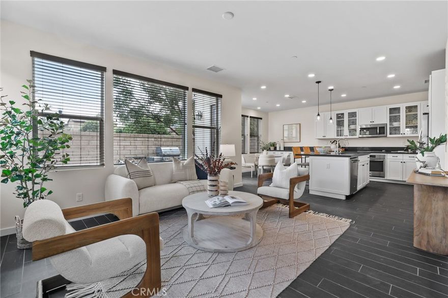 Absolutely Stunning On-Trend Home with FULLY PAID SOLAR! Tucked away on a premium private end-unit lot, this home offers the ultimate in privacy with no rear neighbor and breathtaking mountain views. Featuring 3 bedrooms, 2.5 bathrooms, plus a versatile office nook, this model-quality residence has been meticulously maintained for the best of California living. Step inside to find upgraded tile flooring flowing throughout the first level. The open-concept great room is designed for modern living, showcasing recessed LED lighting, custom paint, and a bright, inviting interior. Sunlight fills the space, highlighting the private backyard oasis just beyond. A designated dining area makes entertaining easy and seamless. The gourmet kitchen is a true showstopper, complete with upgraded stainless steel appliances, reverse osmosis system, extended white cabinetry, quartz countertops, a center island, and designer pendant lighting. Outside, the tranquil backyard delivers serious WOW factor with professionally designed with pavers, artificial turf, built-in firepit, and BBQ area. Backing to open green space, this end-unit retreat is perfect for relaxation and entertaining. The first floor also offers a highly desirable office nook and convenient half bath. Upstairs, you’ll find all three bedrooms and a laundry room. The primary suite is light, bright, and spacious, with sweeping mountain views. Its spa-like bathroom features quartz countertops, stylish tile, a restorative walk-in shower, and dual walk-in closets. This home comes packed with modern upgrades FULLY PAID solar with 10 panels, 220V EV charging in the garage, Full LED lighting package throughout, Upgraded Cat6 tech wiring for TV and internet, Enhanced insulation in floors and walls, Tankless water heater, 2-car attached garage. Residents of Baker Ranch enjoy resort-style amenities, including 3 sparkling pools, 8 parks, scenic hiking and biking trails, tennis courts, beach volleyball, basketball, a dog park, clubhouse, and more. With NO MELLO ROOS AND LOW HOA, this property is truly a rare find. Come see it today!