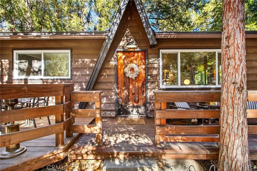 Tucked among the pines, this classic Idyllwild mountain cabin blends cozy charm with thoughtful updates and an ultra convenient location only five minutes from town. The single story layout features a welcoming living room with a white washed fireplace as the focal point, creating a bright and relaxed mountain vibe.  Inside, the home has enjoyed a series of recent improvements, including a newer furnace, newer appliances, fresh interior paint in 2021, and all new windows and doors installed in 2021 for added comfort and efficiency. Both bedrooms are comfortably sized and decorated with easy access to the full bath.  This cabin comes fully turnkey furnished, making it truly move in ready or simple to launch as a getaway retreat.  Outside, you will find a fully fenced yard with an RV gate for off street parking, plus carport parking for added convenience. A shed with a newer deck from 2024 provides extra storage or a perfect project space.  Whether you are seeking a full time mountain home, a weekend retreat, or an investment opportunity, this cabin delivers the quintessential Idyllwild feel with practical upgrades already in place.