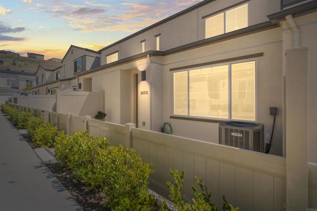 WHAT AN AMAZING VALUE FOR THIS NEW, CRISP AND CLEAN TOWNHOME, OFFERING MINIMALIST, NO MAINTENANCE STYLE LIVING IN THE BEAUTIFUL CITRO COMMUNITY, SURROUNDED BY NATURE, LARGE OPEN SPACES, BLUE SKY AND YEAR ROUND BREEZES. THIS MEYER PLAN ONE IS A MODERN ATTACHED HOME WITH TWO BEDROOMS, TWO CAR GARAGE, STRIKING KITCHEN CABINETRY WITH CONTRASTING QUARTZ COUNTERTOPS, UPGRADED APPLIANCES AND COOL LVP FLOORING COMBINED WITH OWNED SOLAR SYSTEM, EPOXY GARAGE FLOORING AND INCLUDES REFRIGERATOR, WASHER AND DRYER. COMPLETE SET FOR A PERFECT START OF OWNING YOUR HOME! CITRO COMMUNITY, FAMOUS FOR ONE OF THE BEST NEW COMMUNITIES IN SAN DIEGO COUNTY IS A PERFECT BLEND OF MODERN AGRICULTURE AND COMFORT LIVABILITY.