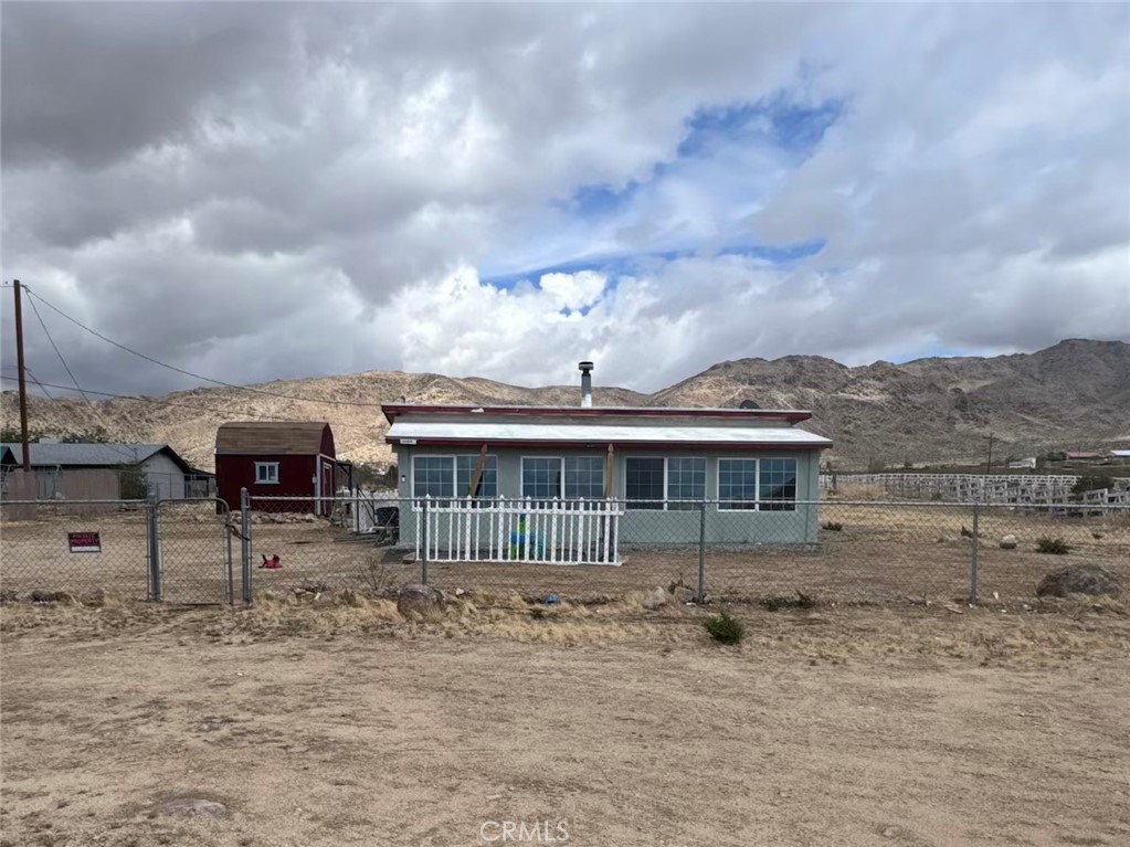 One acre home with 2 bedrooms ,2 bathrooms, a bonus room that can be used as an office or game room. Plenty of space for entertaining family and friends. Shed included. Enclosed patio with plenty of windows for great natural lighting.