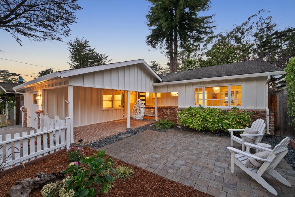 Storybook charm meets the California beach lifestyle in this single-level coastal haven on a quiet, tree-lined street in sought-after Rio del Mar. Just minutes to miles of white-sand beaches, Seascape Golf & Tennis, and all the best of coastal living. A white picket fence and classic brick patio entry welcome you home. Inside, rich hardwood floors and a sun-filled living room with a cozy brick fireplace create warmth and style and the 12 foot sliding glass doors create an exceptional indoor-outdoor living space. The updated kitchen features quartz counters, custom cabinetry, high-end appliances, and thoughtful organizer details. The primary suite offers designer finishes and a spa-like bath with custom tile walk-in shower. Two additional bedrooms and a full bath provide room for family or guests, and a bonus room affords a flexible home office/ den to suit your lifestyle needs. The backyard is a private oasis with a built-in cabana and fireplace for year-round entertaining, paver patios for al fresco dining, lush landscaping, and an outdoor shower ideal after sandy beach days. Every detail reflects care and craftsmanship, making this home a rare blend of character, comfort, and charm. Home is Here!