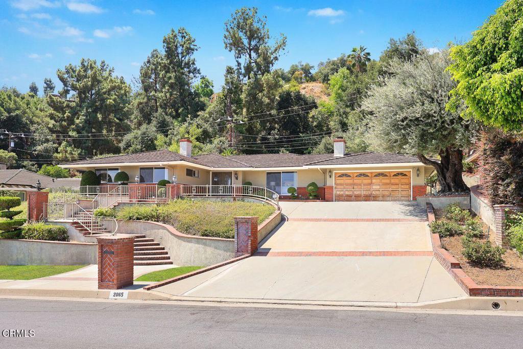Best value in Arcadia .... This beautifully maintained property with spectacular mountain and city lights views is located in the Highland Oaks area. Large living room with a fireplace and crown moldings. Bright kitchen with granite counter tops, Sub Zero refrigerator, dishwasher, Thermador cook tops & oven and it opens to the family room with a fireplace and a large dining area with built-in cabinets. The primary bedroom has a dressing area with double closets. Two secondary bedrooms with city lights views. Laundry room has lots of storage cabinets. Large covered patio with direct access from both living room and the dining area. Spacious 2-car attached garage with an Electrical car charger. Excellent floor plan ... a truly wonderful home in a beautiful area!