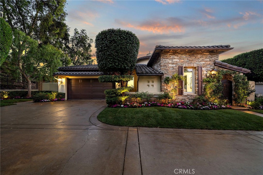 Located in the prestigious guard-gated community of Rivage in Newport Coast, this exceptional single-story residence offers an elegant blend of timeless design and modern luxury. With only one owner since it was built, the home has been meticulously remodeled throughout, showcasing an attention to detail rarely found in today’s market.
Set on an expansive 11,000 sq. ft. lot, the approximately 3,000 sq. ft. floor plan features four bedrooms and three-and-a-half bathrooms, thoughtfully arranged to maximize comfort and ultimate privacy. Inside, new washed oak flooring, soaring solid wood doors, and premium finishes create a refined coastal aesthetic. The gourmet kitchen has been completely reimagined with Sub-Zero and Viking appliances, custom cabinetry, stone counters, and designer fixtures, while all bathrooms—including the spa-like primary retreat—have been luxuriously remodeled to reflect modern elegance.
Every window and French door has been replaced with Jeld-Wen Windows & Doors, offering both style and efficiency, and new faucets have been installed throughout. A long, curved private driveway leads to a two-car garage and provides ample parking for guests. The beautifully landscaped backyard, framed by mature vines, trees, and roses, offers tranquil views, including amazing canyon and city light views, and a rare sense of seclusion, creating the perfect setting for indoor-outdoor living.
This is a rare opportunity to own a fully updated single-level home in one of Newport Coast’s most desirable neighborhoods—just minutes from world-class beaches, premier shopping, fine dining, and award-winning schools.