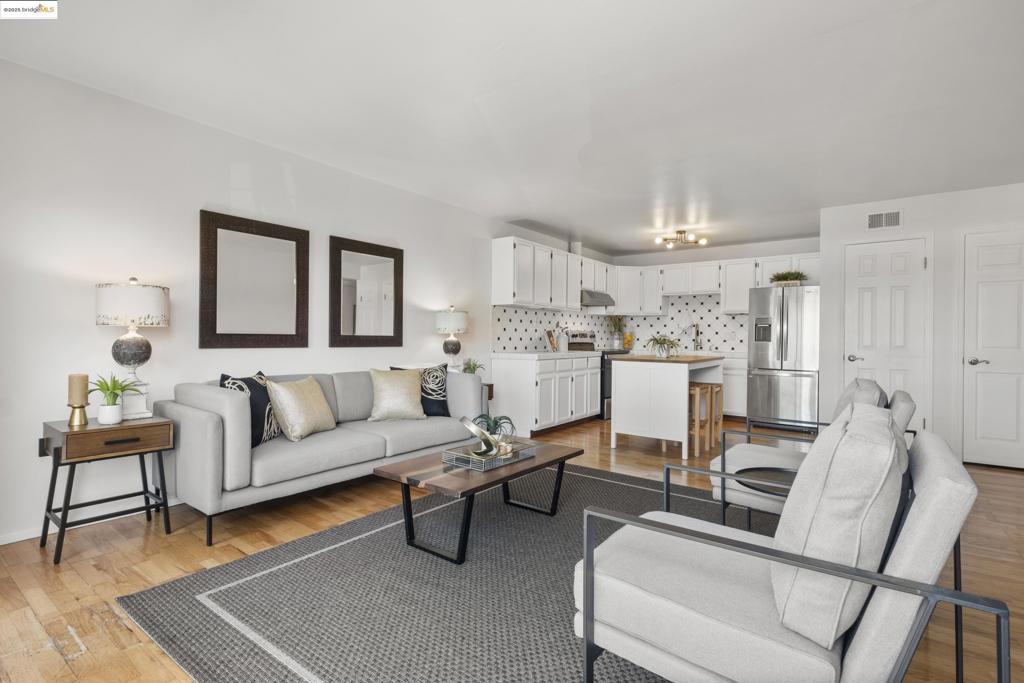 SELLER FINANCING at below market interest available for qualified buyer! Welcome home to your serene retreat in the heart of Ivy Hill—one of Oakland’s most desirable & central neighborhoods. This bright & spacious 2-bedroom, 1.5-bath view unit offers classic charm and modern convenience. Sunny open concept living area and eat-in kitchen offers an inviting atmosphere for entertaining with hardwood floors, ample cabinet & counter space, dining island, and sliding doors that open to a private balcony with partial city and Bay views. Both bedrooms are generously sized, offering comfort and privacy, with abundant closet space and natural light. A full bathroom plus uniquely configured half-bath add functionality & flexibility, making this a unit easy to share. Loads of in-unit storage & add'l large storage space near secure gated parking and community laundry. Enjoy popular neighborhood restaurants and cafes within easy strolling distance, like Champa Garden and Xochi the Dog Cafe. Commuters will appreciate convenient access to BART and freeways. Experience the best of Oakland lifestyle in this great neighborhood