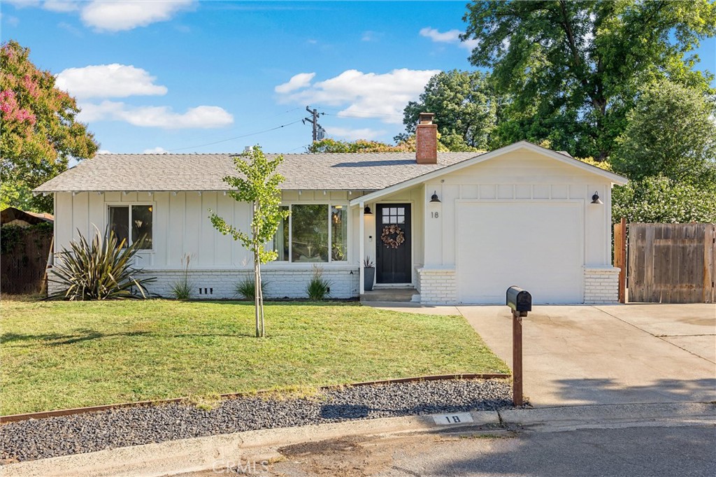 Welcome to 18 El Cerrito Dr, where charm meets modern living in one of Chico's most convenient locations. Nestled on a spacious lot along a quiet, established street, this beautifully renovated 3-bedroom, 1-bathroom home is just minutes from shopping, schools, and freeway access, making it ideal for both everyday living and easy commuting. From the moment you arrive, pride of ownership is clear. The oversized driveway and gated RV parking space (currently set up as a basketball court!) offer flexibility for toys, hobbies, or extra vehicles. Step inside and you'll instantly feel at home in the light-filled living area, where the original hardwood floors bring warmth and character. The open layout flows seamlessly into the dining space, perfect for gathering with friends and family. The remodeled kitchen is a true showstopper. Featuring sleek granite countertops, large tile flooring, and a stylish mix of crisp white upper cabinets and rich-toned lowers, this space combines beauty and function. Stainless steel appliances, ample storage, and direct access to the covered back porch make cooking and entertaining a breeze. Just off the kitchen is a bonus room, currently used as a home office, but perfectly suited for a walk-in pantry, hobby room, or added storage to match your lifestyle. One of the most thoughtful features of this home is the split floor plan. The garage has been converted into a spacious primary bedroom tucked away for added privacy, while two additional bedrooms sit at the opposite end of the home, ideal for guests, kids, or home office needs. Out back, you’ll find an expansive yard on nearly 1/3 of an acre—ready for anything. Enjoy established fruit trees, including pomegranate, nectarine, mandarin, and grapevines, as well as raised garden beds prepped for your future harvests. There’s plenty of space to play, relax, or create your own backyard oasis—whether that includes a pool, a garden retreat, or even a flock of chickens. With plenty of room to grow, relax, and entertain, this property offers the lifestyle you've been dreaming of. Don't miss your chance to own this gem in the heart of Chico!