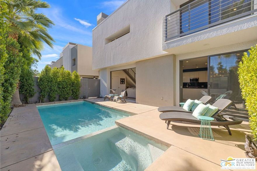 Prepare to be wowed by this ultra-modern 2 bed, 2.5 bath loft-style residence behind the gates of 48 @ Baristo - a sought-after collection of contemporary residences on land you own in the heart of Central Palm Springs. Just blocks from restaurants, entertainment, the baseball stadium, aquatic center, and more - this location delivers true access to Palm Springs living. Designed for buyers who crave modern architecture and seamless indoor/outdoor flow, the property showcases soaring ceilings with exposed beams, clerestory windows, polished concrete and wood flooring, and a wide-open floor plan filled with natural light. Multiple outdoor living areas surround a private saline pool and spa, creating a true desert retreat. The west-facing entry and patio set the tone, leading into a refreshed kitchen anchored by a large detached island that overlooks the dining and living areas. A gas fireplace and three sets of sliding glass doors blur the line between inside and outideal for entertaining or relaxed everyday living. Downstairs also features a private bath with direct access to the attached two-car garage, complete with built-in storage and a dedicated EV charging station. Upstairs, the Primary Ensuite offers designer finishes, a spa-inspired bath, walk-in closet, and private access to a second-floor landing with stunning mountain views. A separate upstairs casita with its own exterior entrance includes a walk-in closet, ensuite bath, and exceptional viewsperfect for guests or a private office. Additional highlights include rooftop solar added in 2023. Modern, stylish, and ideally located. This is Palm Springs living at its best.