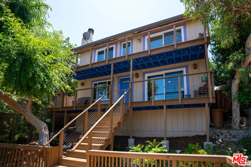 This wonderful house in the hills of Mount Washington is bathed in natural light, has vast views of the San Gabriel Mountains from every room, and exudes a sense of comfort and ease. The public rooms are downstairs and the private spaces upstairs. Indoor-outdoor living is very natural at this home. Two bathrooms have recently been beautifully remodeled including skylights. The upgraded kitchen features new quartz countertops and a new farm house sink and faucet. Top of the line, hardy Trex board was used to build the outdoor decks, steps and railings. The windows and sliding glass doors have all been replaced with double pane glass. The California garden is lush and fragrant. The primary ensuite bedroom boasts a large walk-in closet and sliding glass doors to the deck. One can access the deck from the second bedroom too. The third bedroom has been outfitted as an office/music room, and from this room, you can view the iconic DTLA skyline. Hardwood floors run throughout the house. There is an abundance of built in storage space. Over the garage is a large deck from which to enjoy the views or dance under the stars. The backyard features a hot-tub and space for dining, lounging, gardening, or playing. Property is located within the highly esteemed Mount Washington Elementary attendance area. Additionally, the Carlin G Playground is around the block. Easy access to public transportation including the Gold Line. Life is private at 353 Mavis Dr. yet close to everything.