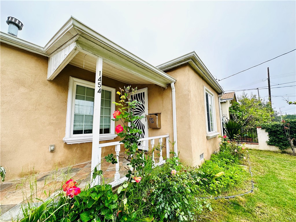 Charming recently painted 3 bedroom, 2 bath house, with an open floor plan and a BONUS ROOM. Newer A/C unit installed in living room in 2022 and newer dishwasher installed 2023. Also comes with newer refrigerator, tile and laminate flooring throughout, tankless water heater, larger washer/dryer room with washer/dryer included. Incredible back and front yard with a tiled back deck and large yard with multiple fruit trees, vegetables and flowers, perfect for entertaining. Very close to multiple grocery stores, shopping and many excellent restaurants. This one is not to be missed!