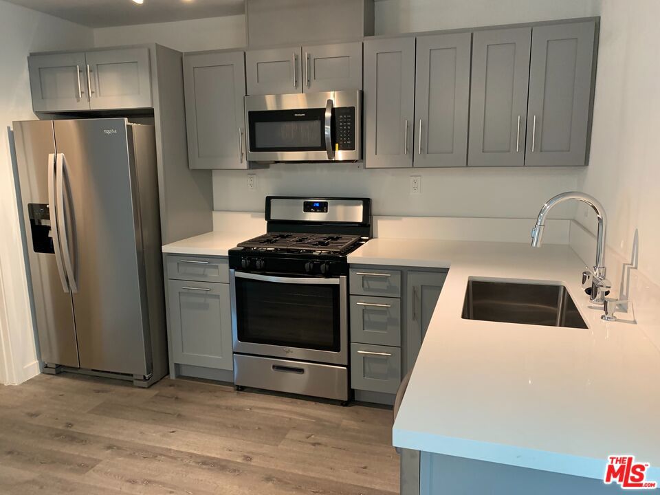 Take advantage of our rent promotion up to month free plus parking included! This charming first-floor 1 bedroom, 1 bathroom apartment in North Hills features stainless steel appliances, including a stove/oven, refrigerator, and microwave. Enjoy modern comforts with wall A/C and heat, hardwood flooring, and an updated bathroom with a stylish tile shower. Pets are welcome, and tenants are responsible for utilities, with water and sewer billed monthly by the owner. Renter's insurance is required. Photos similar to available unit.