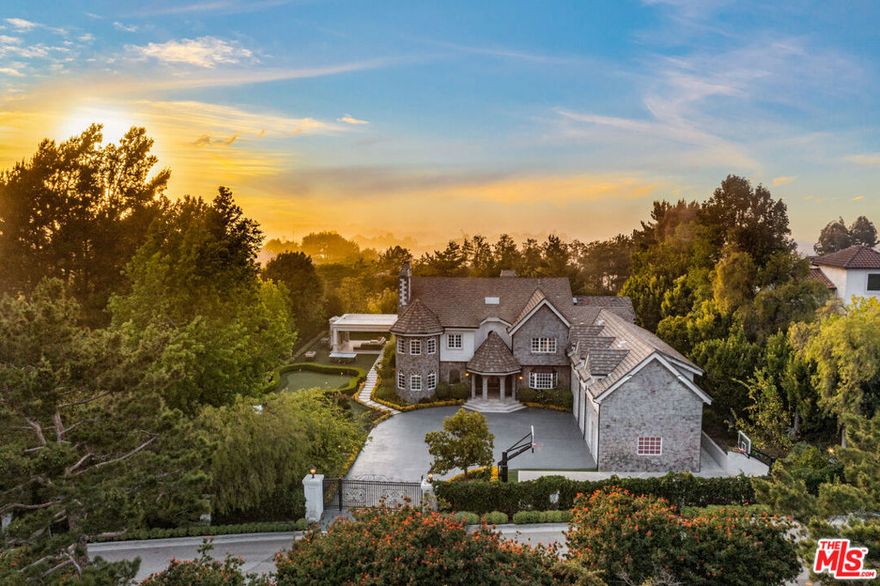 A double-gated, park-like estate in Bel Air, this luxury furnished residence offers nearly 8,500 square feet of refined living space set on an expansive, lush near-acre lot featuring manicured gardens and a private basketball court.The home includes (7)  bedrooms, highlighted by a well-appointed primary suite with a private seating area, dual spa-style baths, and custom walk-in closets, along with two additional flex rooms ideal for a home office or gym. Designed for both elegance and entertaining, the residence features a chef's kitchen with high-end appliances, formal dining and living rooms, a wine cellar with poker lounge, and integrated smart-home technology throughout.The grounds unfold as a private resort-style oasis, complete with a swimming pool, multiple lounge areas, BBQ and fire pit, a putting green, and a grand, immaculately landscaped garden offering the ultimate in privacy, scale, and luxury living.