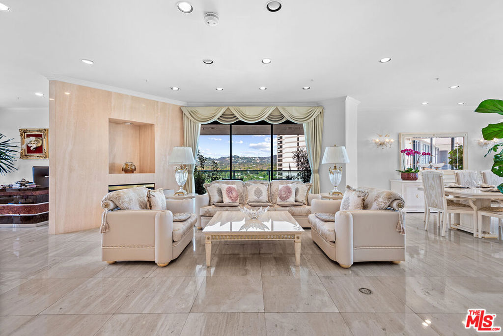 Experience luxury and comfort in this elegant 3 bedroom, 3 bath residence (currently being used as 2 + den) perched on the 12th floor of The Blair House, one of Wilshire Corridor's most desirable full-service buildings. Flooded with natural light, this spacious home showcases sweeping city and mountain views, including Century City, snow on the San Gabriel Mountains and Bel Air, through floor-to-ceiling windows, creating a serene and inspiring backdrop throughout. The formal dining area and generous living spaces are perfect for entertaining, complemented by timeless finishes and beautiful travertine marble floors. The expansive primary suite features a large bedroom, a spa-like bathroom, and a large walk-in closet. The second bedroom with ensuite bath, offers flexibility for guests, a home office, or den. Additional highlights include large laundry with lots of additional storage and 2 zones of heat and air. The Blair House offers an unparalleled lifestyle with 24-hour valet parking and security, Huge sparkling saline pool & spa on large pool deck featuring lots of comfortable seating and BBQs. A new huge fully equipped gym is currently under construction. Spacious rec room and north/south tennis court with lights complete the picture. This is better than living at The Four Seasons Hotel!