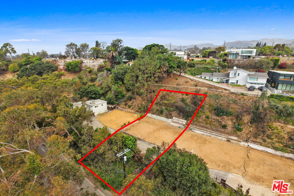 The sweetest spot on Sunset Blvd., across from beautiful and serene Rustic Canyon and a short distance to the Village and Santa Monica State Beach, lies this beloved property, waiting for it's next family. Perched above Sunset Blvd., this small enclave of 5 properties is located on its own private access road. The 7000 sq. ft. lot stretches from Sunset Blvd. almost to Gallaudet Pl. above. The access road crosses the property by way of an easement, which would allow for potentially up to 2500 sq. ft. new build. Previous house was approx. 1400 sq. ft. Both EPA remediation and debris removal have been completed. Property is not located in the Coastal Commission zone. Although their time here was brief, the owner absolutely loved living here.