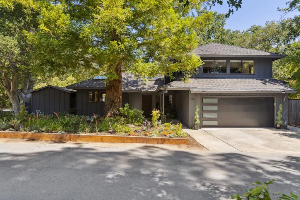 Discover this mid-century modern-style gem in the sought-after Corte Madera neighborhood. Positioned on a desirable street and flat lot at the top of Canyon Drive and Crescent Road, this 3-bed, 2-bath home features vaulted ceilings, an open floor plan, fireplace, hardwood floors, floating staircase and abundant natural light through glass doors, picture windows and skylights. The versatile bedroom or possible media room on the first-floor opens to an inviting outdoor space with a fenced backyard and garden. Additional highlights include a 2-car garage with side yard access, washer/dryer hookup, and a storage shed for extra workspace. Enjoy a pet-friendly, active community walking distance to top rated public and private schools, Roberts Market, biking routes, and network of local hiking trails, just minutes from Stanford University and Palo Alto without ever having to get on the highway.