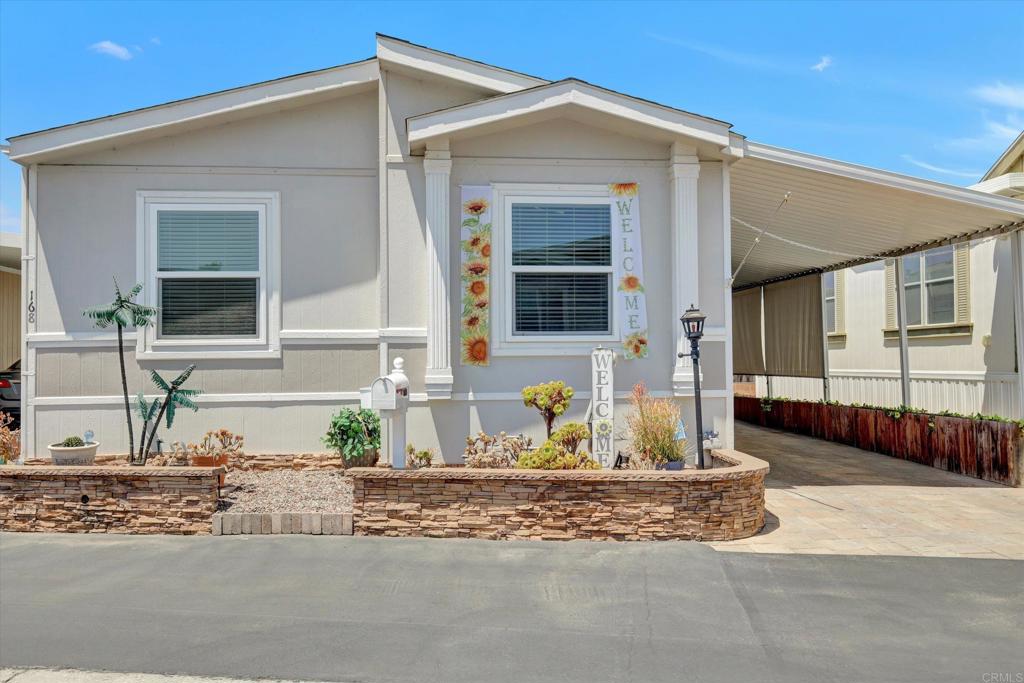 This 2004 Golden West 1200 SF 2 Bedroom (+ Bonus Room), 2 Bath (Both 3/4) Home resides within San Luis Rey Homes Resident OWNED 55 + Community. Land Ownership is involved. The low H.O.A. ($175/Mo) includes Trash, Sewer WATER & Park Maintenance. AND THERE IS NO SPACE RENT. This Beautiful & improved upon home boast, Solar (11 panels), newer Tankless Water Heater, Newer 16 Seer AC Central Unit, Generac Home Generator, an EV Charging Outlet, recently (2020) Exterior painted, Paver Driveway, Ceiling Fans throughout. Beautiful Stack Stone Front Planter. Double Pane Windows. EQ BRACING Quartz Kitchen Counters. The Maytag Washer & Dryer may remain. So can the ‘Counter Depth’ Whirlpool Refrigerator. SLRH Community Is conveniently located about 4 ½ miles from the ‘Sands & Pier’ of Oceanside. The Historic Mission San Luis Rey is ‘walking’ distance. Plenty of Shopping (Albertsons, Ralphs, Lowes, Vons, Stater Bros & Walmart for example. Nearby Medical such as Scripps Coastal, VA Clinic, Kaiser Office as well.