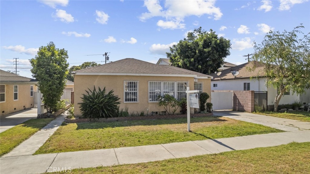 Charming 3 bedroom, 2 bathroom single family residence in the heart of South Gate. Offering 1674 sq ft of living space, this home features a spacious layout with generously sized rooms throughout. The full kitchen provides ample space for cooking and dining, while the large backyard offers plenty of room for outdoor living or entertaining. Laundry is conveniently located in the garage, adding to the home's practicality. Situated in a central location near schools, parks, and local amenities, this home presents an excellent opportunity for comfortable living in a vibrant community.