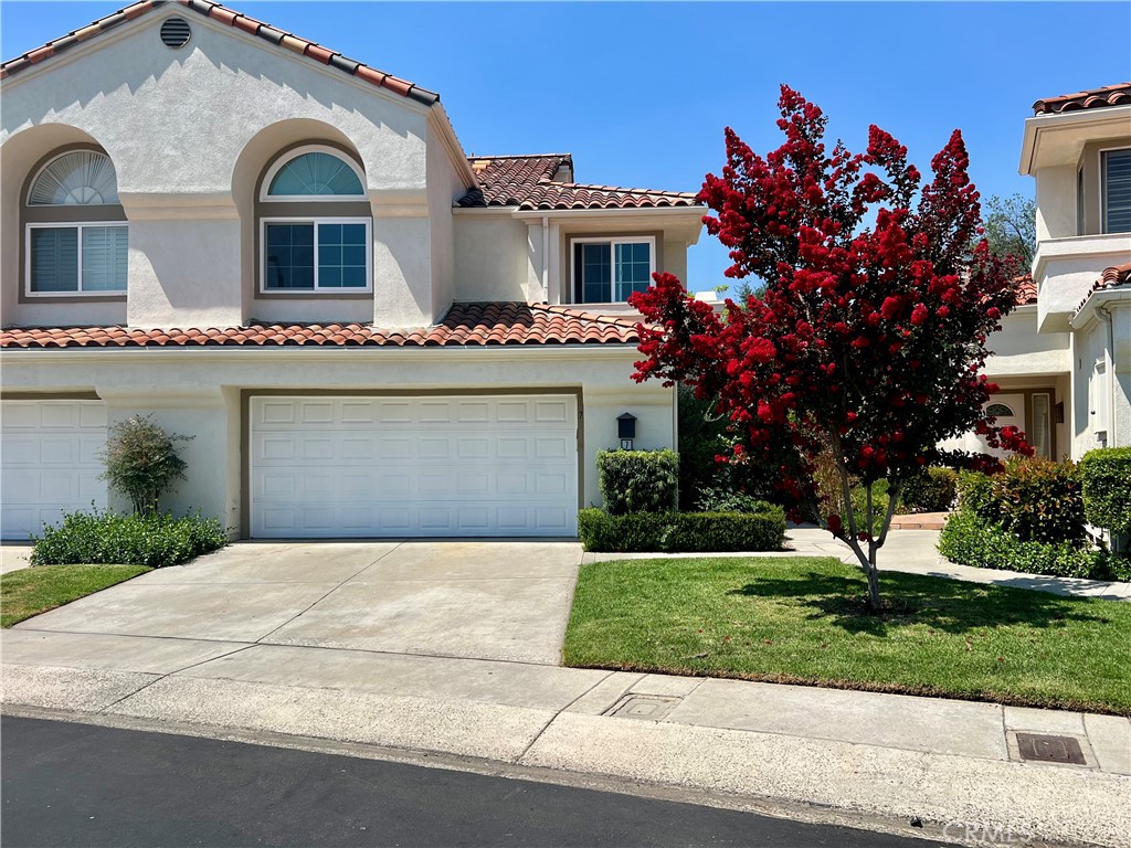 Welcome home to this gorgeous Marbella townhome with a beautiful view of the Lake! The townhome features 3 bedrooms, 2 1/2 bathrooms in approximately 1,810 sqft. with engineered hardwood floors, plantation shutters, recessed lighting, ceiling fans, and custom cabinetry. The remodeled kitchen has stainless steel appliances, granite counters, subway tile backsplash, and is open to the living and dining rooms. Upstairs boasts a large primary suite with ample closet space, extra storage, and a private balcony with lake views. The luxurious primary bath welcomes with dual sinks, a soaking tub, and separate shower. Two additional, large bedrooms with Saddleback Mountain views share a remodeled bath. The garage is a dream with epoxy floors and tons of storage, including a work space! Outside, you will find a private, covered patio with a built in BBQ, bar seating, fridge, and lovely views. All this within close proximity to schools, shopping, restaurants, and the incredible RSM lake facility!