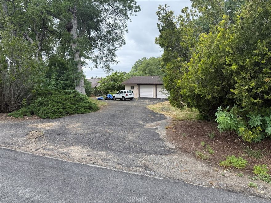 Located near the end of a quiet, paved cul-de-sac, this 4.33-acre property offers distant mountain views, privacy, and potential. Featuring a solar-heated inground pool, circular driveway, and a detached garage/workshop tall enough for an RV, it’s a great opportunity for those seeking a mini-ranch or mountain escape. Public records and prior listings indicate the home offers 4 bedrooms, 3 baths, and approximately 3,592 square feet, including a formal dining area, office, and game room. The listing agent has not had access to the interior. All details are based solely on public records and prior MLS data. Buyer to verify all information to their satisfaction, including square footage, features, and condition. Conveniently located for commuting to Fresno or Oakhurst and close to Bass Lake for recreation. Bring your vision and discover the possibilities this property holds.
