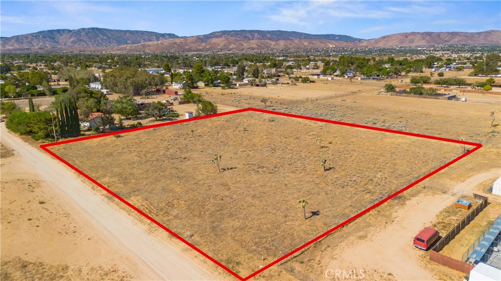 Excellent opportunity to purchase a 2.5-acre custom homesite in prime West Palmdale! Reduced and priced aggresively! Located within the prestigious White Fence Farms, this land parcel is ready for you to build your dream custom home. White Fence Farms is the Antelope Valley's premier horse property area. It combines the best of rural living with a unique location in the heart of West Palmdale. Large estate homes in this area routinely sell for over $1M. This parcel is nearby the intersection of 30th west and Ave M, which places it in close proximity to neighborhoods such as Los Hermanos and Desert Rose, which are also million-dollar areas. It's also very close to Forrest Hull Park. This property provides a wonderful blank canvas, 2.5 acres of flat land with homes on all sides. The lot has been scraped of weeds and it's ready for building. With this acreage, there's ample room for a sprawling custom mansion, multiple guest houses, pool/spa, tennis court, basketball court, small soccer field, horse facilities, gardens, RV garages, workshops, etc. This property already has a water meter installed! Gas and electric connections appear to be available at the street. This property sold for $250k in 2007. If you've been looking for the ideal place to build your dream home, you've found it. For $189,900, you can purchase 2.5 acres of prime land, in a neighborhood that contains million-dollar homes, with utilities ready for connection. With its quiet dirt roads, large lots, and impressive estate homes, White Fence Farms provides a lifestyle that is the ideal mix of rural living and luxury, while also being minutes away to all of the suburban conveniences that West Palmdale offers. There are not many unbuilt lots left in White Fence Farms and they are in demand. Purchasing this property allows you to secure your piece of this area and build your dream custom estate home to your exact specifications. This is truly a great opportunity and it's priced to sell. Don't miss out!