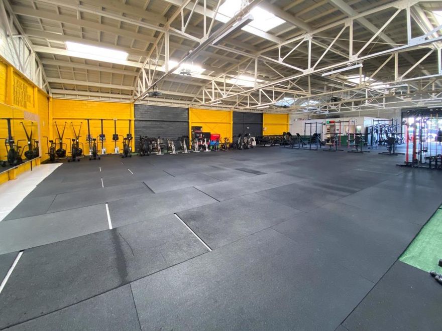 Freestanding 6,200 SF commercial building featuring 25-ft ceilings, roll-up and drive-in doors, showroom, private offices, and two restrooms. Zoned CN-3 and suitable for a wide variety of commercial uses. Situated on a 7,341 SF lot at a high-traffic intersection near Bancroft Ave. Tenant-occupied. Excellent opportunity for owner-user or investor.