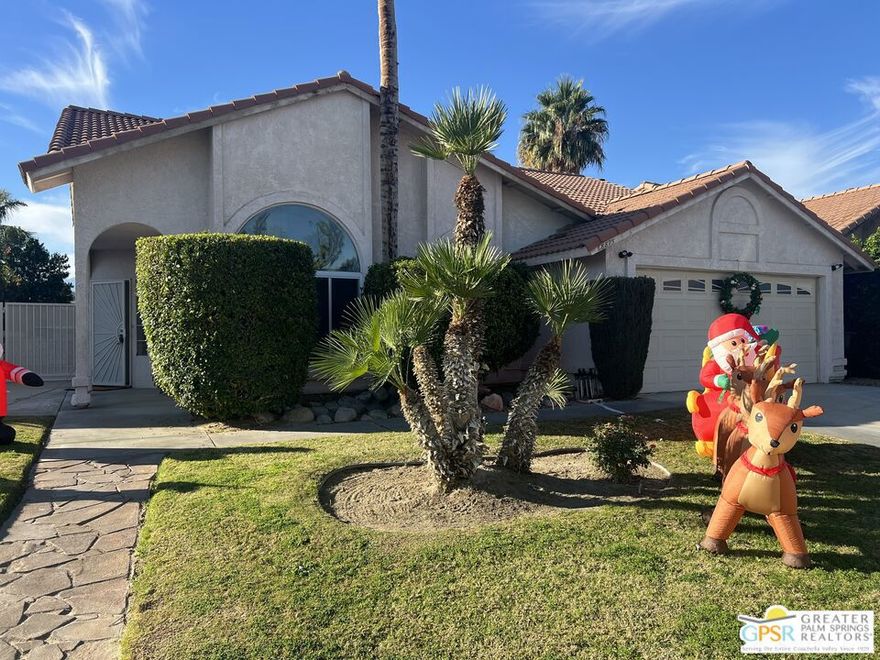 Set in the middle of the Coachella Valley's famous Candy Cane Lane is a perfect 3 bed, 2 bath split level home. The kitchen has granite countertops and stainless steel appliances. There's access to the large L-shaped pool and spa from the living room, upstairs bedroom deck and the master bedroom patio. The attached 2-car garage is actually big enough for storage on both sides. You'll be close enough to walk to Panorama Park for baseball, tennis and soccer. Panorama Park also has walking paths and a playground. Simply because you're on Candy Cane Lane, the street is highly desirable (within the city) due to its built-in sense of community and festive holiday spirit. This is a wonderful opportunity for first-time buyers, an investor, or anyone looking for a centrally located home in a friendly neighborhood.