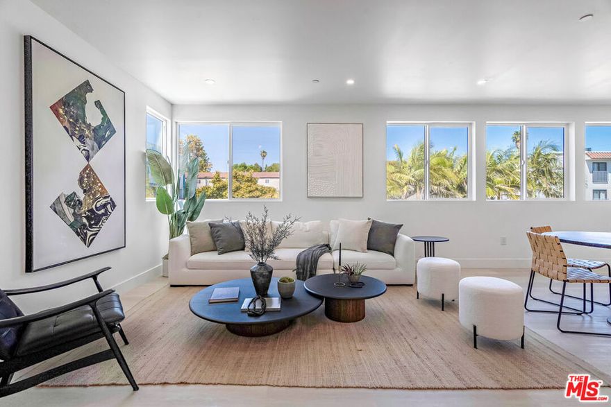 Your opportunity to own a spacious, design-forward home in one of Los Angeles' most dynamic and appreciating neighborhoods has arrived. Introducing "The David I", a newly built 3-bedroom, 3.5-bathroom front-unit townhouse located within a 3-unit new construction apartment complex near the Culver City Arts District. This thoughtfully designed residence features an expansive layout that blends everyday functionality with modern aesthetic appeal. The open-concept main level connects a sleek contemporary kitchen with the living and dining areas, offering an ideal setting for hosting, relaxing, or working from home. A versatile bonus room on the entry level adds flexibility for use as a home office, gym, or creative studio. Upstairs, the well-appointed bedrooms provide space and comfort, including a peaceful primary suite with en-suite bath and ample closet space. This unit also enjoys a dedicated, private grassy front patio, a rare offering perfect for outdoor dining, gardening, or simply enjoying LA's year-round sunshine. Additional features include wide-plank flooring, designer finishes throughout, and side-by-side covered parking for two cars. As a Senate Bill 8 (SB-8) exempt property, this home is not subject to rent control, allowing future owners the freedom to lease the property without restrictions. 2-Car garage as well as private driveway for two additional cars. Located just minutes from Erewhon, Destroyer, the Helms Bakery District, and top employers like TikTok, Google, Sony, and Amazon Studios, this is a rare chance to own modern construction with both lifestyle and long-term investment upside. This is a TIC offering requiring TIC-specific financing or an all-cash purchase. Contact the listing agent for lender referrals and further details.