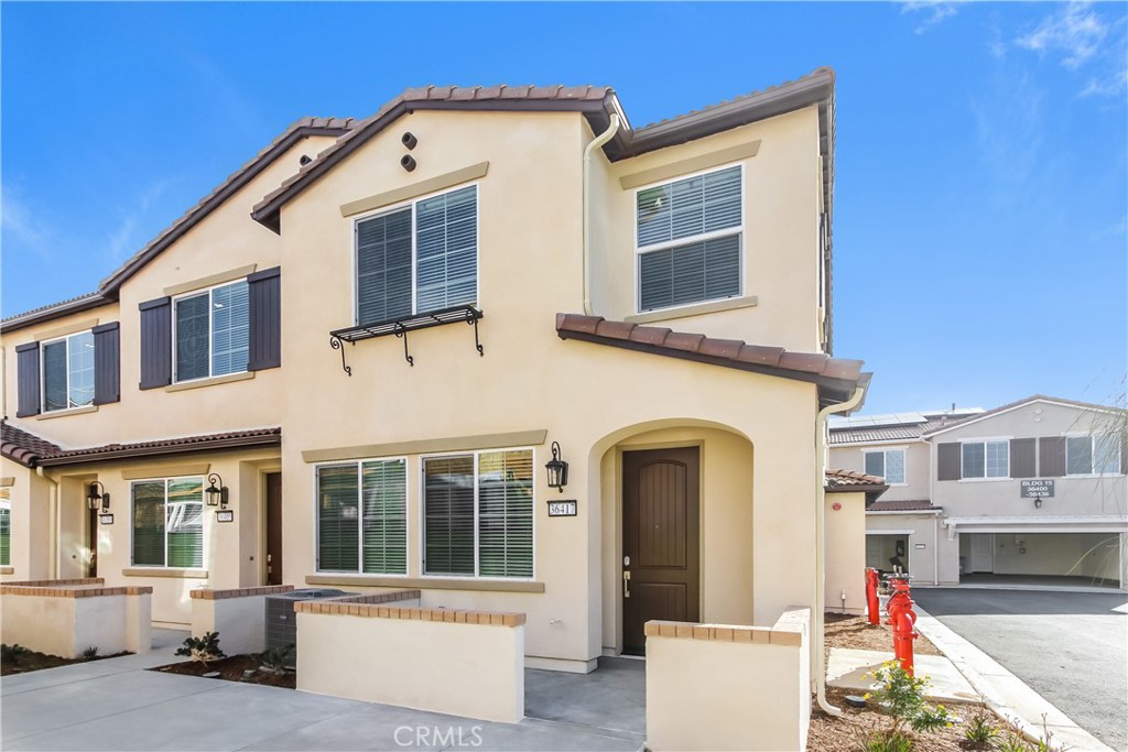 This home is professionally managed by Tricon Residential, dedicated to creating exceptional rental experiences. Featuring three bedrooms, two and one half bathrooms, and approximately 1,361 square feet, this townhome offers a high standard of rental living, supported by a team that puts residents first. Tricon Wildomar is a beautiful Spanish-inspired gated community centrally located just one hour from San Diego and Orange County. Enjoy virtually maintenance-free living with the conveniences of solar and smart home technology including automatic thermostat control and keyless front door entry all designed to provide an exceptional living experience. Every home includes an open-concept design, gourmet kitchens with quartz countertops and stainless steel appliances. Enjoy well-maintained amenities including a sparking pool with wifi, tot lot/playground, dog park, fitness center and clubhouse with rentable event space.