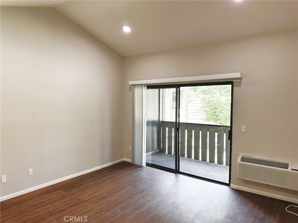 Located in the community of Pheasant Creek, this beautifully remodeled upstairs 1-bedroom, 1-bath condo is a true gem. Step inside to brand-new laminate wood flooring, dramatic vaulted ceilings, and recessed lighting that brighten the space. A sliding glass door leads to a charming private patio complete with a laundry closet and washer/dryer, with the soothing sound of a bubbling brook below. The sleek galley kitchen features shaker-style cabinetry, quartz countertops, stainless steel appliances, and striking black accents. The oversized bedroom boasts a spacious walk-in closet and an ensuite bathroom with an elegant quartz vanity and a stunning tile shower with a pebble floor. Comfort is ensured year-round with a new wall-mounted heat and AC unit. This home includes a one-car garage with additional community parking, and water and trash service are provided. Available for a 12-month lease with a one-month deposit, strong credit and income required. No smoking permitted. Don’t miss the opportunity to call this beautiful space your home!
