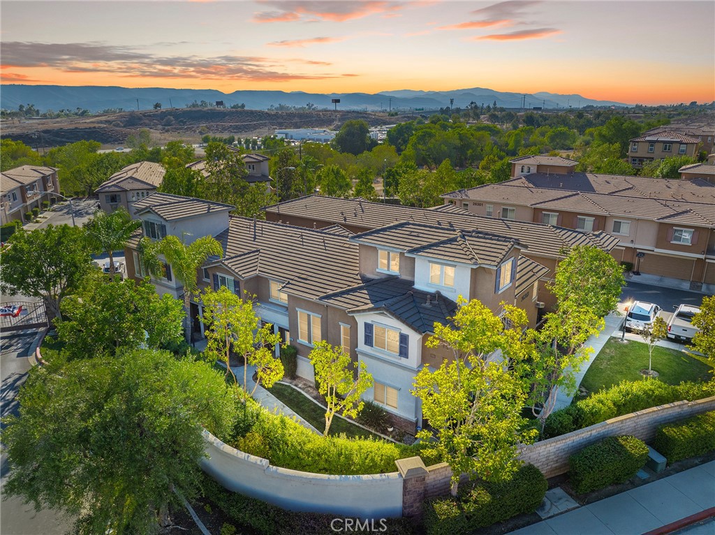 Stunning and Private end-unit home in the highly sought after gated community of Arboretum! This location is perfect with plenty of parking nearby as well as a 2-car garage! At almost 2,000sqft, this home features the largest floor plan in the community! As you enter, you will find a spacious layout featuring a living room with cozy fireplace and dining room that leads you to the heart of the home, the large upgraded chef’s kitchen with island and pantry as well as an under-sink water filtration for drinking and stainless steel appliances that flows into a large family room.Downstairs also includes a separate closet area, indoor laundry room and a powder room and a door leading to under stairs that can be used as storage, wine rack, pet nook, the ideas are endless! The back patio with a stunning custom wood bar includes lighting and TV mount perfect for entertaining and also has access to the 2 car garage. The second floor features 3 bedrooms, two bedrooms both have access to a Jack and Jill bathroom and the primary suite features its own large bathroom with a soaking tub, separate shower, dual sinks and a very large closet. The bonus room is located on the third floor! This is a flex room that can easily be converted to a 4th bedroom/playroom/office tech area. This home has a brand NEW HVAC system under warranty that is energy efficient to keep utilities low and features a wi-fi thermostat. All appliances convey including the refrigerator, washer and dryer! For added convenience, the detached two-car garage is easily accessible from the patio. This prime location borders Temecula and the Arboretum community offers an array of amenities, including two resort- style pools, two hot tubs, Barbecue area, Clubhouse, Two tot lots and beautifully maintained park-like grounds. The HOA covers private security, pool and landscape maintenance, gated entrance upkeep, water, trash, and sewer providing a low-maintenance, stress-free lifestyle. Guest parking is conveniently available throughout the community. Located just minutes from top-rated schools, shopping, dining, and major freeways, this exceptional home offers the best of Temecula Valley living.